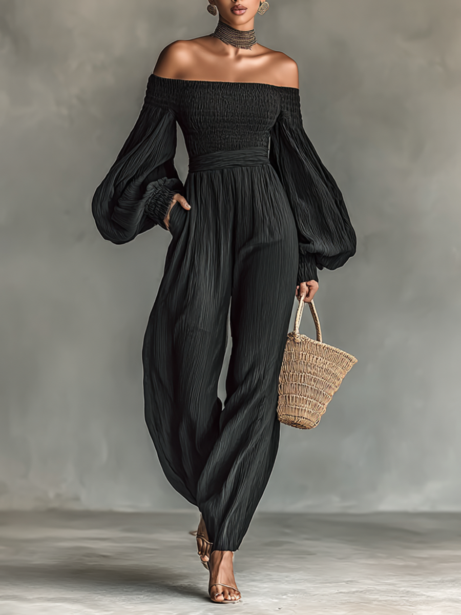 Dames jumpsuit van geplooid stof met blote schouders en lange mouwen
