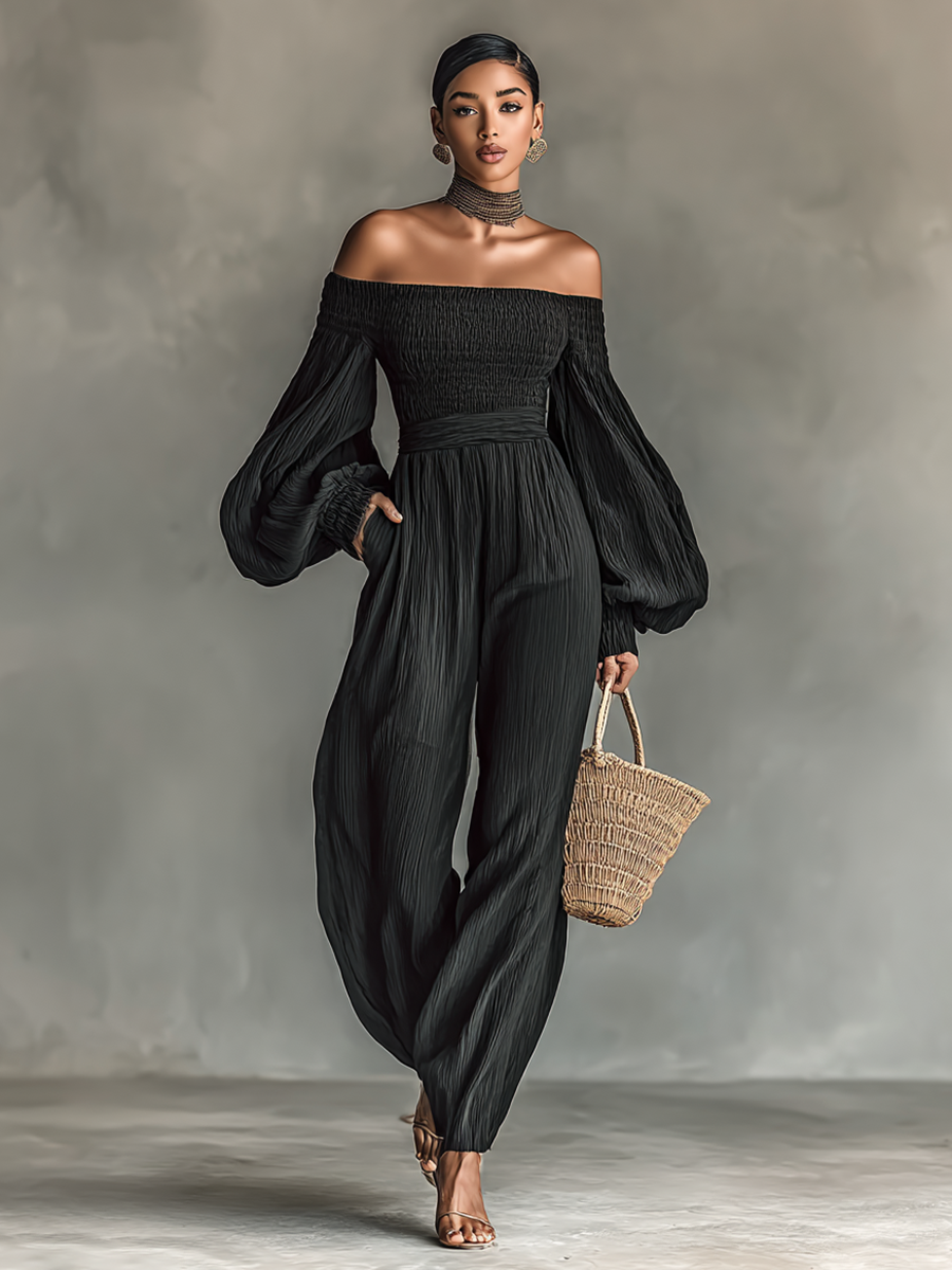 Dames jumpsuit van geplooid stof met blote schouders en lange mouwen
