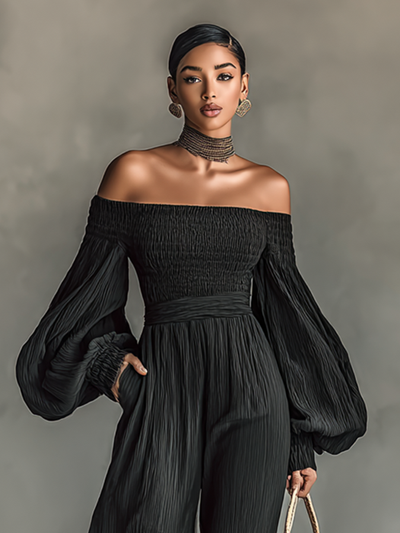 Dames jumpsuit van geplooid stof met blote schouders en lange mouwen